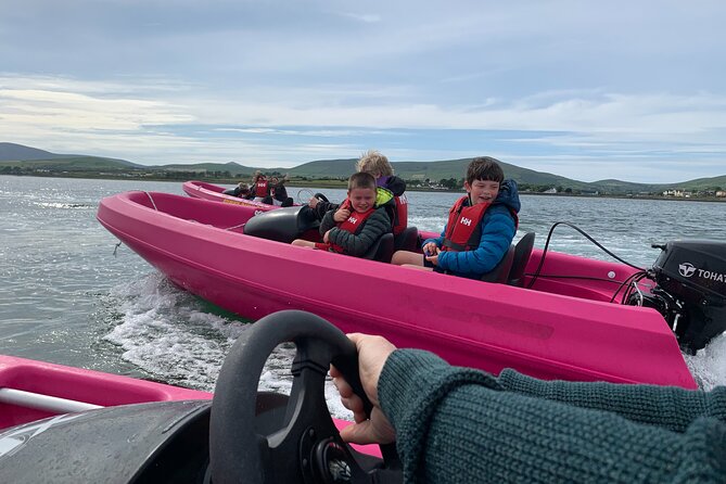 Funky Pink Self Drive Boats - Taking the wheel inside Dingle Harbour